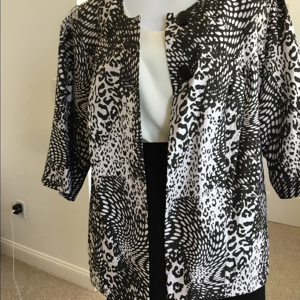 Slightly worn black and white jacket